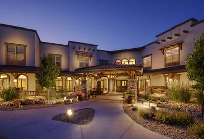 Exterior view of the assisted living facility at dusk