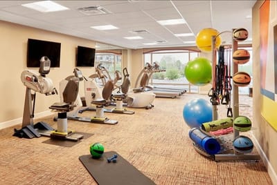 Well-equipped fitness room with exercise equipment