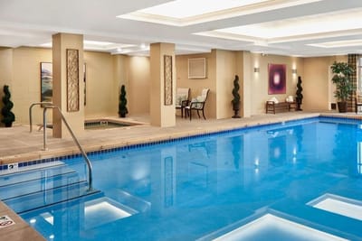 Indoor swimming pool area with seating