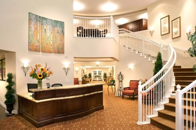 Elegant lobby area with floral arrangement and seating