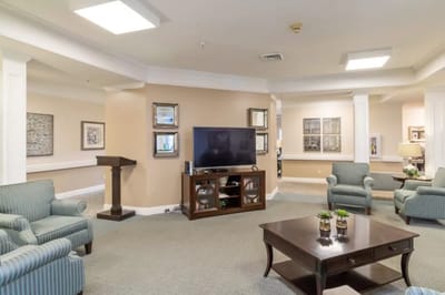 Interior common area with seating and a TV