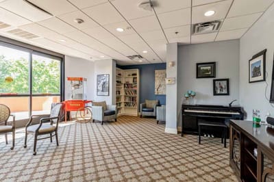 Interior common area with seating and bookshelves
