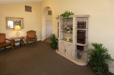 Interior view of a cozy common area with plants