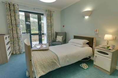 Cozy private room with a bed and seating area