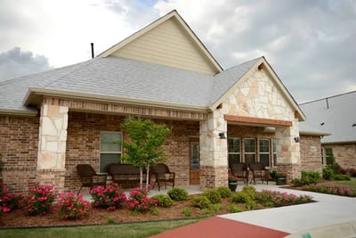 Exterior view of Mustang Creek Estates with landscaped front