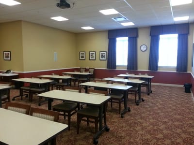Interior view of a room with tables and chairs