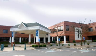 Saint Luke Lutheran Home – North Canton, Nursing Home in North Canton, OH — Main entrance of a senior living facility with parking lot