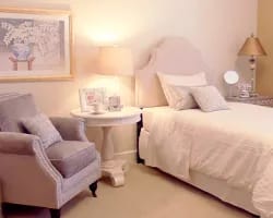 Saint Luke Lutheran Home – North Canton, Nursing Home in North Canton, OH — Cozy bedroom setting with a bed and armchair