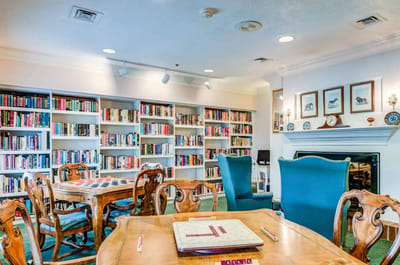 Interior common area with bookshelves and seating