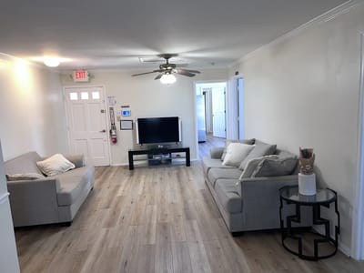Bright common area with couches and television
