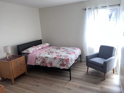 Well-furnished private room with floral bedding