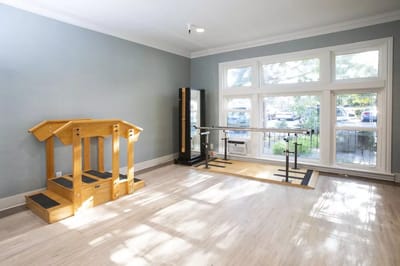 Interior view of a rehabilitation area with exercise equipment