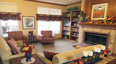 Cozy common area with seating and bookshelves
