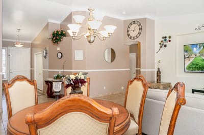 Bright common area with dining furniture and decor