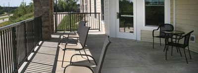 Outdoor balcony area with seating