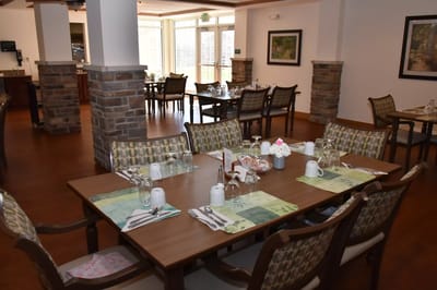 Bright dining room with tables set for meals