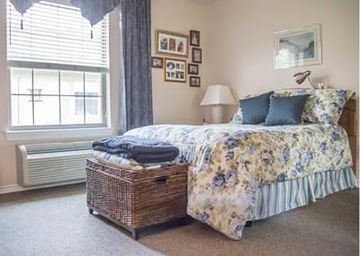 Cozy resident room with floral bedding and decor