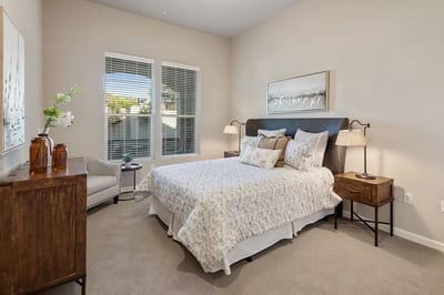 Cozy private resident room with a bed and seating area