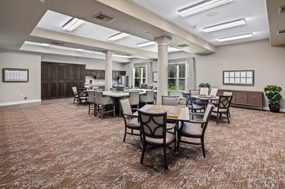 Bright common area with seating and tables