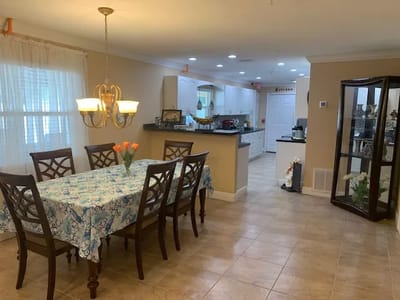 Dining area with a table and chairs in a well-lit room