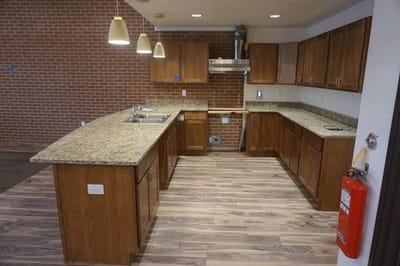 Newly designed kitchen area with modern cabinets