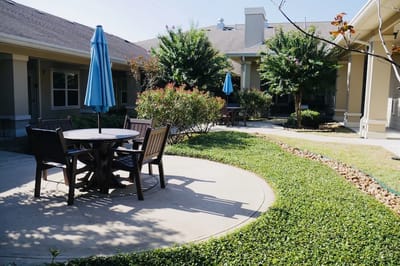 Courtyard seating area with tables and umbrellas