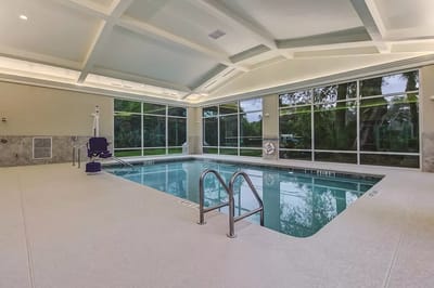 Indoor swimming pool area with natural lighting