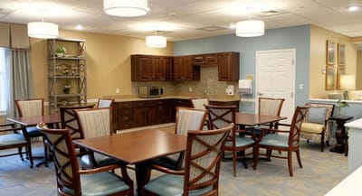 Bright indoor common area with tables and chairs