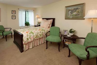 Cozy resident room with floral bedding and furniture