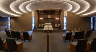 Interior view of a serene prayer space with seating