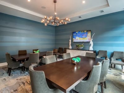 Modern lounge area with a large table and chairs