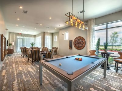 Interior common area with a pool table and seating