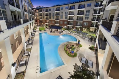 Aerial view of a vibrant pool area in a senior living community