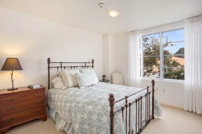 Private room with a bed and window
