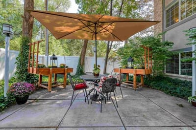 Outdoor seating area with plants and shade