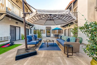 Outdoor seating area with sunshade and comfortable furniture