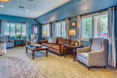Bright common area with comfortable seating and natural light