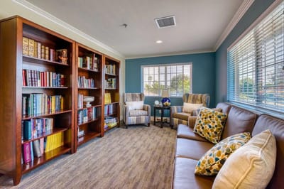 Cozy common area with bookshelves and seating