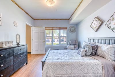 Bright and cozy resident room with a bed and window