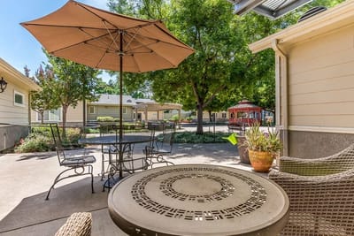 Outdoor patio with tables and umbrellas