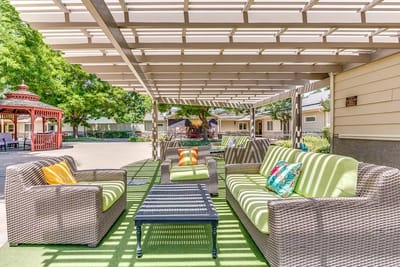Outdoor seating area with covered patio and comfortable furniture