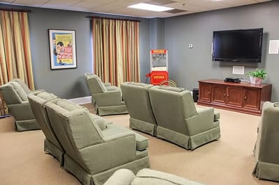 Cozy common area with seating and entertainment equipment