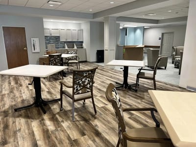 Interior view of a common area with tables and chairs