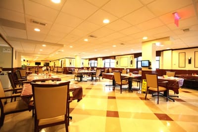 Dining area with tables and chairs set up