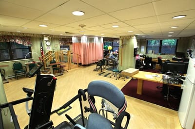 Rehabilitation center activity room with exercise equipment