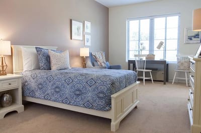 Cozy resident room with bed and desk