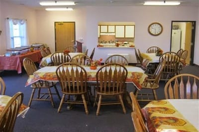 Dining area with wooden tables and chairs