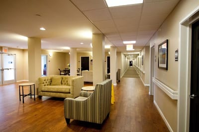 Interior hallway with seating area in a senior residence