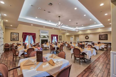 Elegant dining room setup with tables and chairs