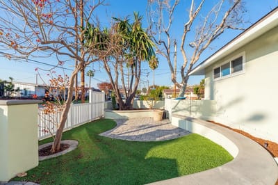 A peaceful outdoor garden area with paths and trees